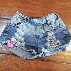 Distressed cutoff denim shorts with fading